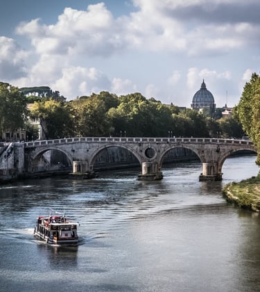 a boat on the water with a bridge in the background in Rome