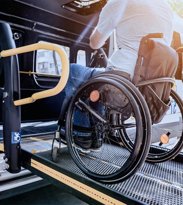 a man in a wheelchair on transport