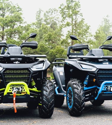 two atv atvs parked in a parking lot