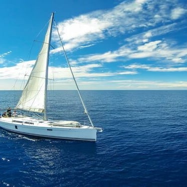 a sailboat sailing on the ocean