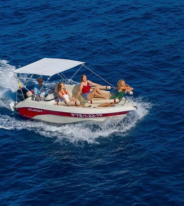 a group of people on a boat in the ocean