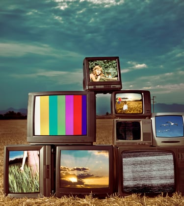 Image of abandoned televisions in a desert representing made-for-TV screenplays built for serialized