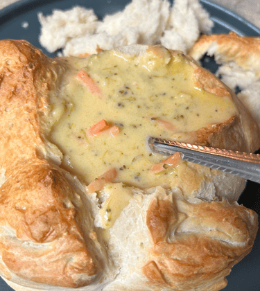 Bread bowl filled with brocoli cheddar soup