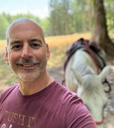 Rod with his horse in the background.