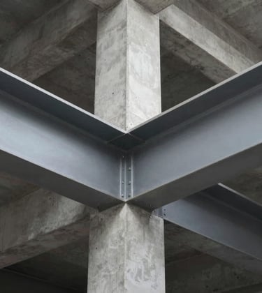 A close-up architectural detail shot focusing on structural excellence. Visible are precision-engineered steel beams and reinforced concrete work on a high-end site. The lighting is crisp and clear, emphasizing safety and durability. Tones of #4A5759 and #212121 dominate.