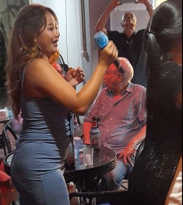 Thai woman singing at bar party on Soi 94 in Hua Hin