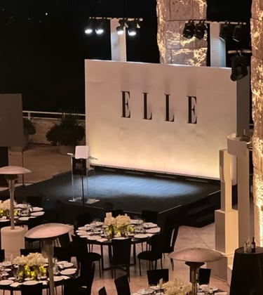 a stage with tables and chairs and a stage