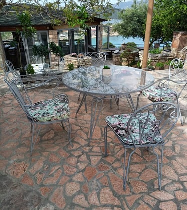 "Unwind in Style with a Meal at John's Guesthouse Tavern, Featuring Stunning Views of Ksamil's Bay!"