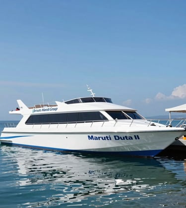 The private Maruti Group jetty at Nusa Penida, showing the Maruti Duta II fast boat docked. The scene is professional and organized, highlighting the exclusive access and safety of the service. Clear blue sky and calm water reflect the brand's reliability.