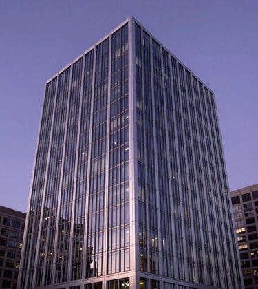 A crisp, professional architectural shot of a modern financial headquarters in a major North American / US city. The building features glass and silver steel under a deep violet evening sky.