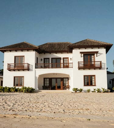 A luxurious beachfront mansion with colonial architectural influences, white walls and dark wood accents, located on a pristine Latin American beach.