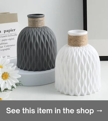 White & gray textured ceramic vases with rope accents for minimalist Scandi home decor