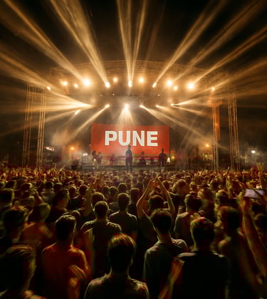 A dynamic, high-energy shot of a grand event in Pune. The composition captures the motion of light and people using a cinematic videography approach, emphasizing the scale and professional production quality.
