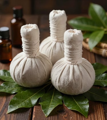 Close-up photography of natural herbal compress balls, essential oil bottles, and fresh green leaves neatly arranged on a dark wood surface in Bandung, West Java / Indonesia, illuminated by soft warm ambient lighting.