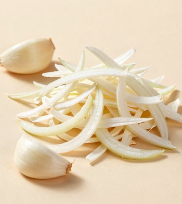 A luxury food photography shot of premium dehydrated white onion flakes and garlic cloves on a clean beige surface. High-key lighting, minimalist composition.