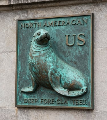 A close-up of a North American / US bronze seal or plaques on a stately stone wall, representing institutional strength and governance. The lighting is crisp and dignified, with colors reflecting Deep Forest Teal and Dusty Sage.