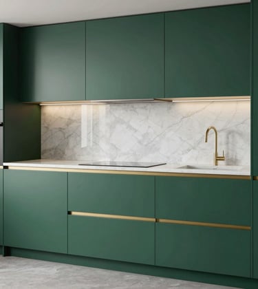 A sleek, modern modular kitchen with matte royal dark green cabinetry and seamless metallic gold trim. Soft white marble backsplash.