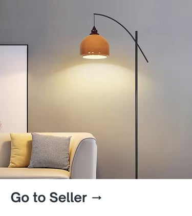 Arched floor lamp with warm lighting beside a neutral sofa