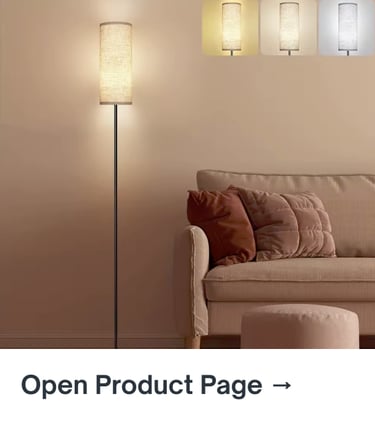Tall cylindrical floor lamp with warm light in a neutral living room