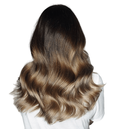 Woman with balayage blonde highlights and smooth styled hair.
