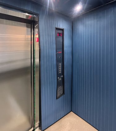 elevator interior with long protection pads installed to protect the wall during moving times