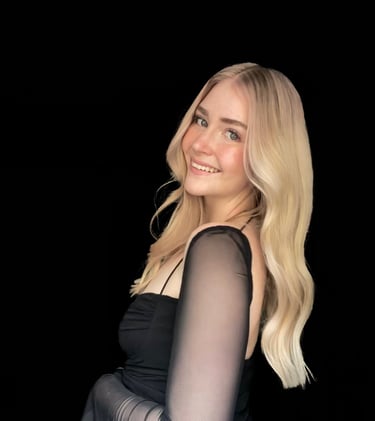 Nicole fine line tattoo artist creating elegant feminine tattoos at Aura Tattoo Studios