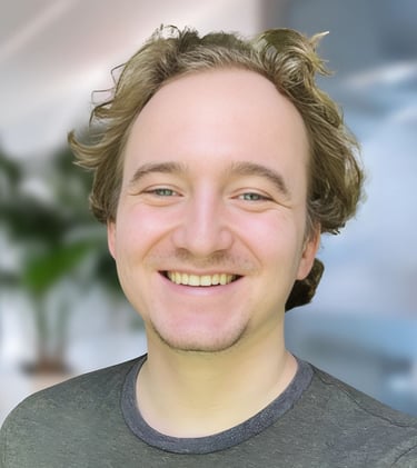 a man with a beard and a beard smiling