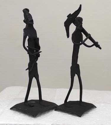 "Handmade iron sculpture of tribal farmer with plough, wife holding child-for worldwide trade"