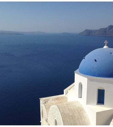 a blue dome shaped building with a blue dome shaped building in Santorini Cyclades