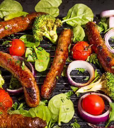 Sustainable plant-based, nutritionally-dense, hypoallergenic protein and fibre sausages with vegetables surrounding