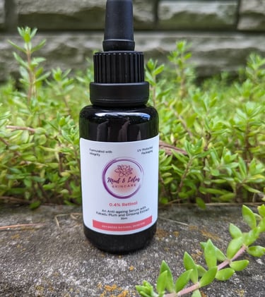 a bottle of retinol sitting near plants