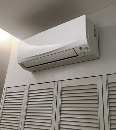 a white air conditioner with a white air conditioner