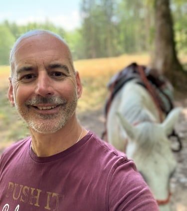Rod with his horse in the background.