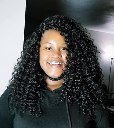 a woman with a crochet hairstyle