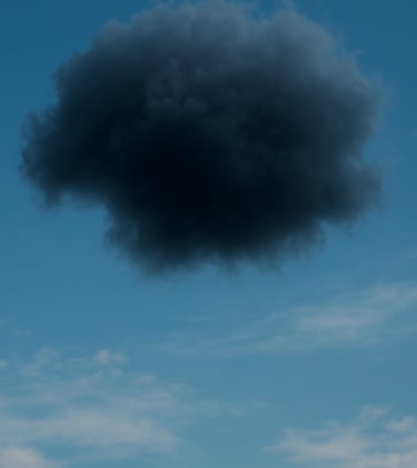 A dark storm cloud in a blue sky