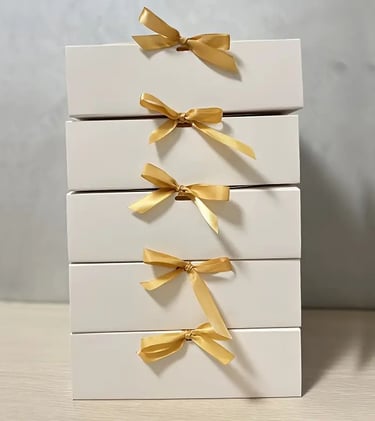 gift box with white and gold bow