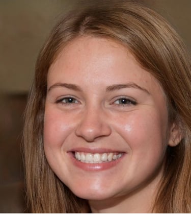 A smiling young woman with light brown hair and green eyes posing for a portrait headshot.