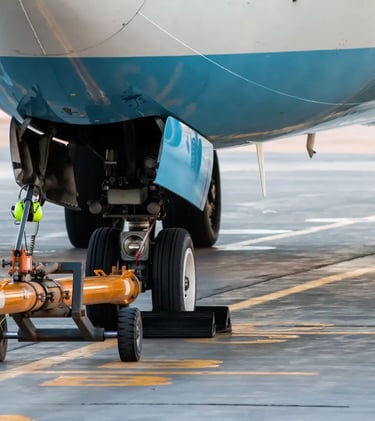 an airplane with a air compressor on the ground fill Jet Fuels & Gasoline