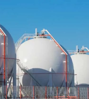a row of white Gases tanks