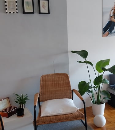 a living room with a chair and a table