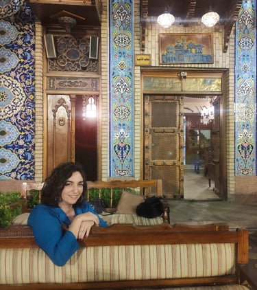 a woman sitting on a couch in a room