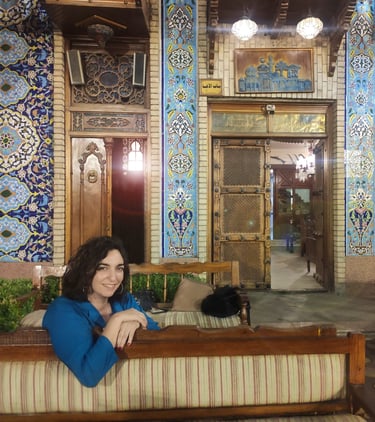 a woman sitting on a couch in a room