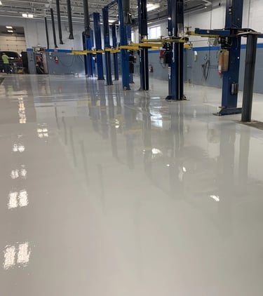 Solid color epoxy floor in commercial shop