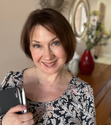a woman in a floral dress holding a tablet