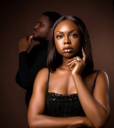 Confident Black woman in deep thought with man blurred in background,