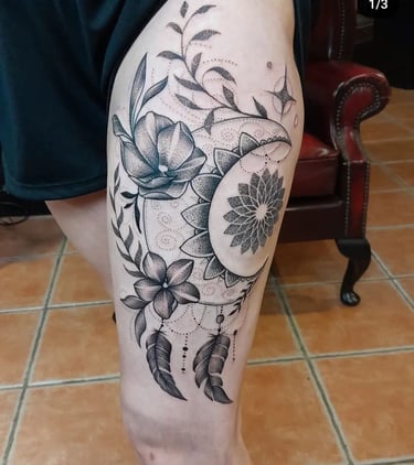 Ornamental leg tattoo