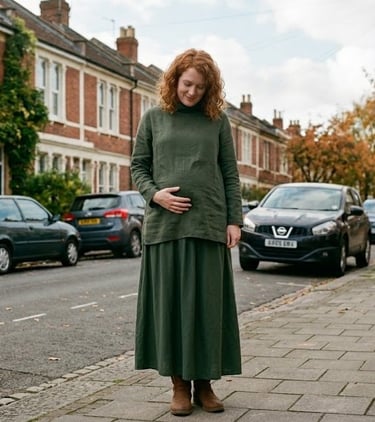 Pregnant woman stands in a UK street.