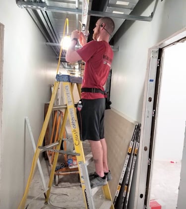 One of our electricians working hard at customer satisfaction!