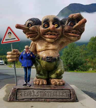 Lady Michelle and a 3-headed troll near Trollstigen, Norway