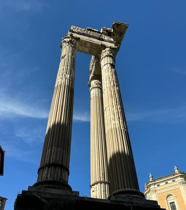 The ruined columns of the Temple of Saturn in Rome, Italy